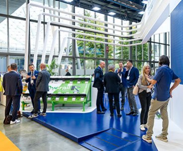 Exhibitors and visitors meet on a stand space at EXPO Ferroviaria